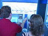 Saturday - Monorail - Person Buying Ticket With Nickels