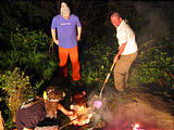 Pig Roast - Saturday - Putting Hot Rocks in Pig - Leo Brady Perlman