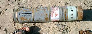 Malarrimo Beach - Military Device - Navair phosphorus marker? - Labeled "Notify police or military." (1/2/2002 3:41 PM)