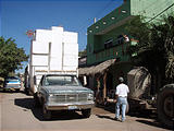 La Manzanilla - Tall Truck Going Under Xmas Decorations in front of Homestay House