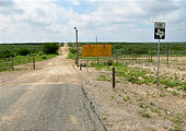 Texas - Mexican Border Road Along Rio Grande From Eagle Pass to Laredo - Where the Pavement Ends - Sign End Farm Road 1021