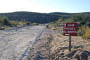 El Barril - Road to San Miguel - Sign