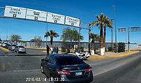 Baja - Mexicali - USA Border - Calexico II - Chaotic intersection, turning left into border complex - Police Officer