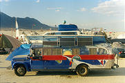 Neighbor - Bus with Boat on Roof (photo by Laura)