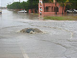 La Paz Rain Storm - Manhole Cover - Water Coming Out of Sewer