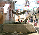 Comachuén - Woman Getting Water from Well in Buckets