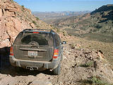 rough downhill section of Rec Rd. 230 & Lake Powell in the distance (7/27 5:02 PM)