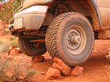 Sportsmobile Tires: BFG All-Terrain T/A KO LT285/75R16 (33") on stock steel 16x7 Ford E-Series rims, hubcaps removed